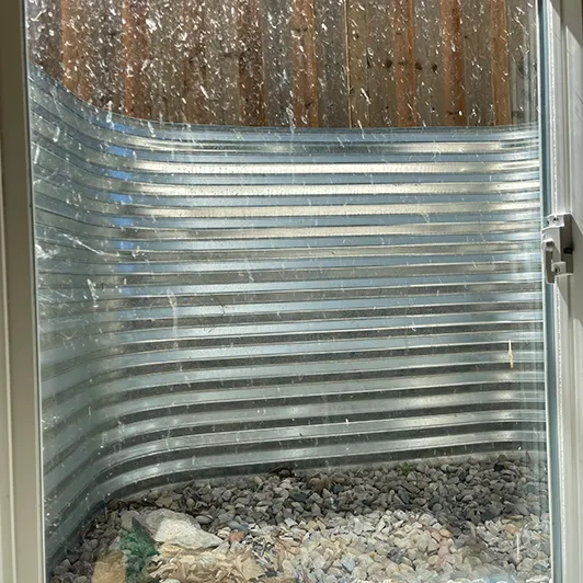 Grimy basement window before cleaning at a London, Ontario home