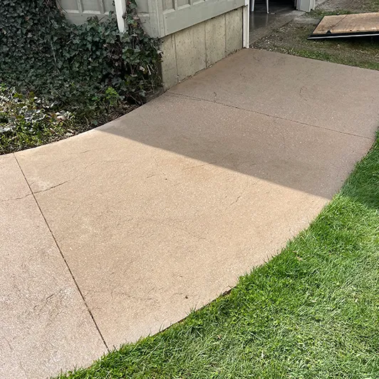 The same sidewalk after pressure washing