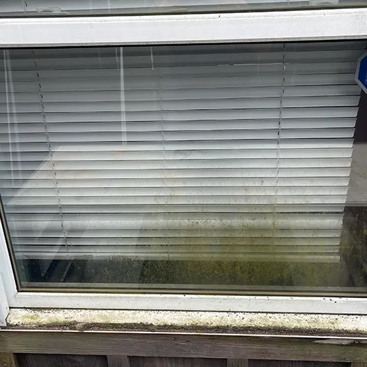 Small window streaked with dirt before cleaning