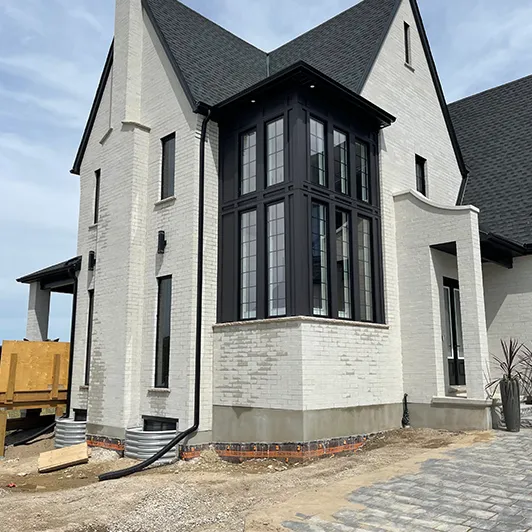 Tall white house with freshly cleaned windows
